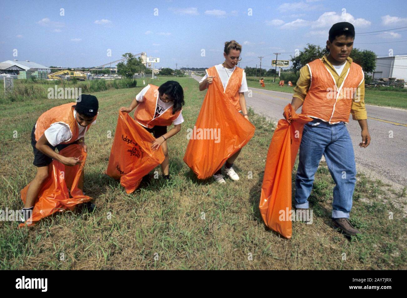 New Braunfels, Texas Teen volunteers clean up roadside trash. ©Bob