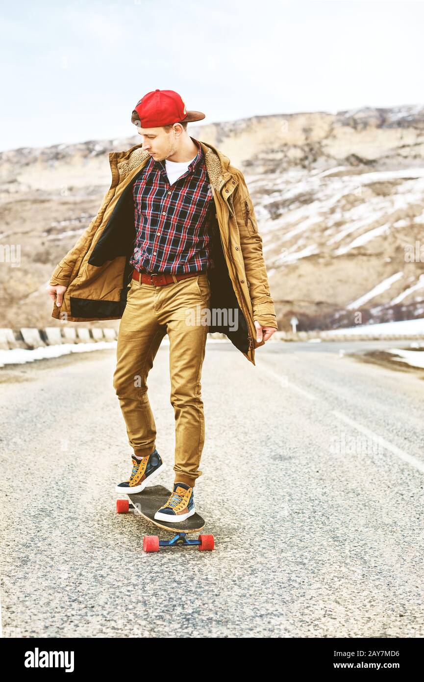 Stylish happy Young guy in a cap and 