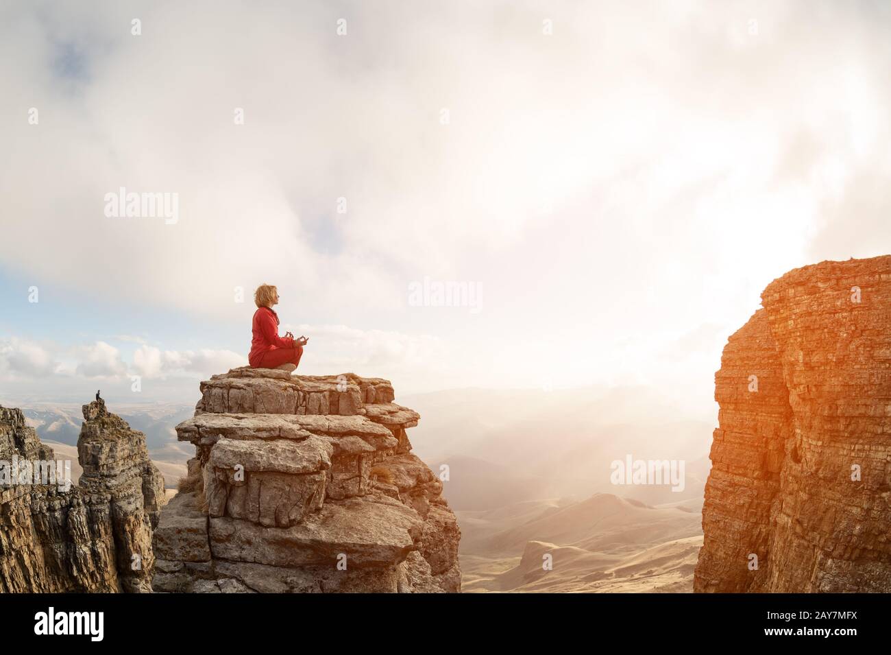 Beautiful girl sitting on rock hi-res stock photography and images - Alamy