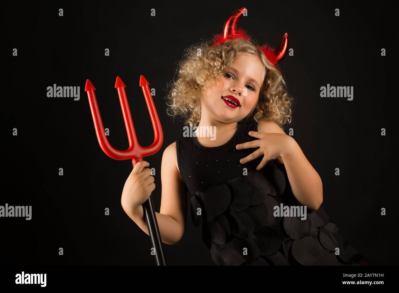 Attractive girl in devils costume Stock Photo - Alamy