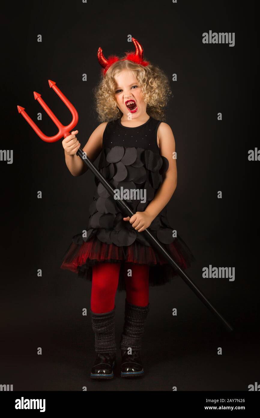 Beautiful girl in devils costume Stock Photo - Alamy