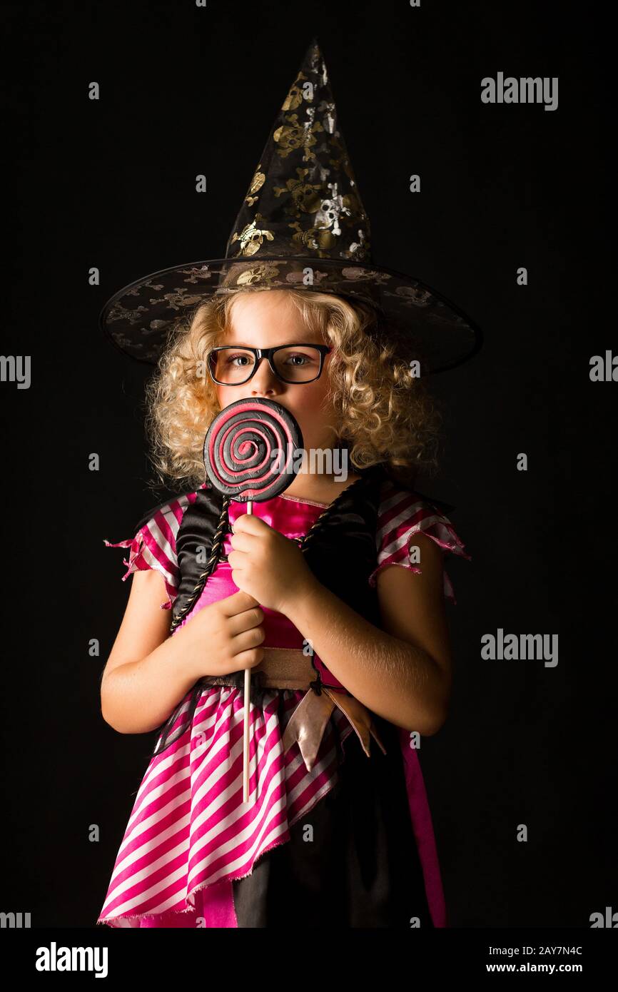 Attractive girl in witch halloween costume Stock Photo