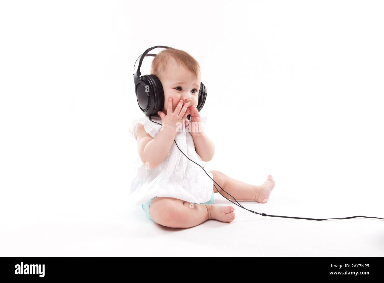 Future Mom holding headphones on her big belly, while her unborn baby  listening pleasant sounds and melody. First Child Anticipation Stock Photo  - Alamy