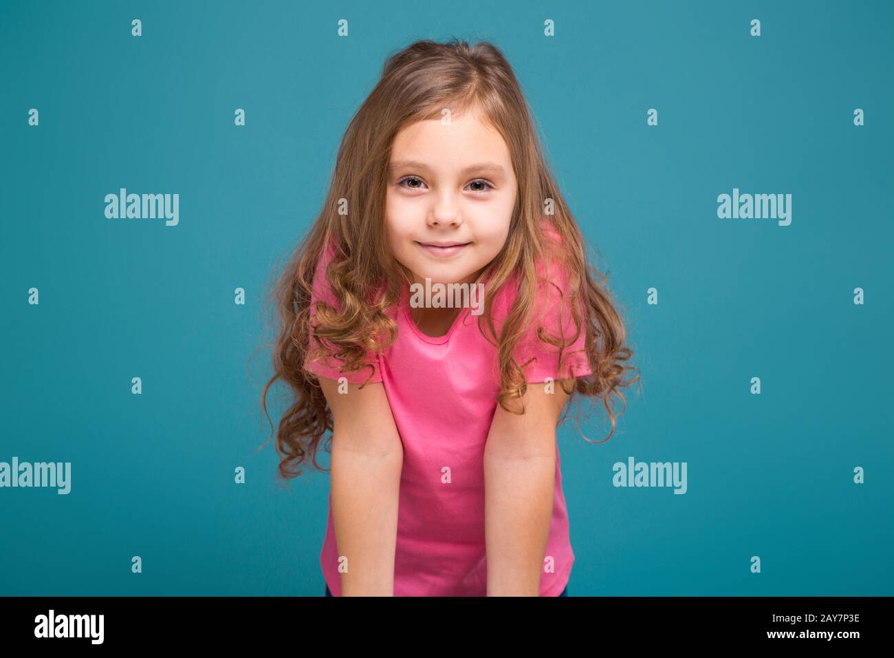 Pretty, little girl in tee shirt with brown hair Stock Photo