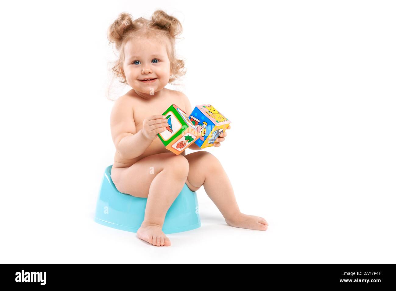 girl with toys on the pot Stock Photo