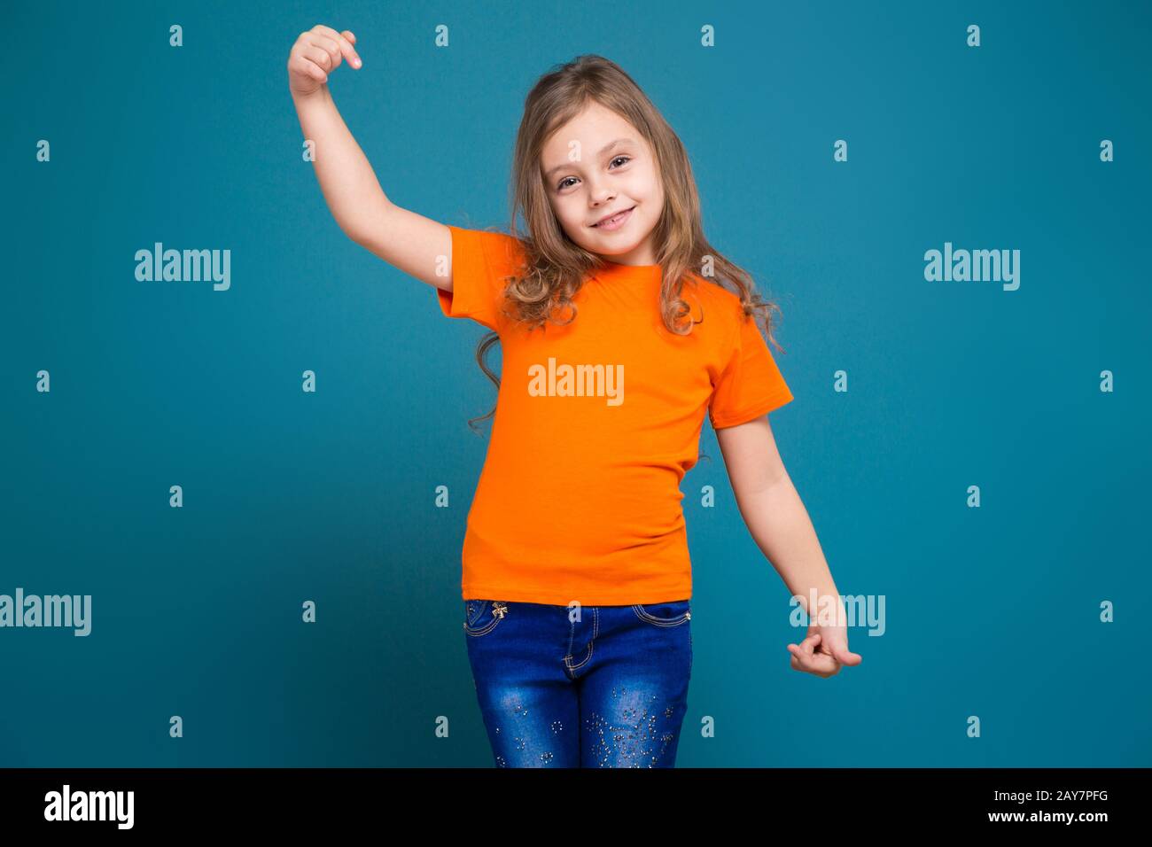 Cute little girl in tee shirt with brown hair Stock Photo