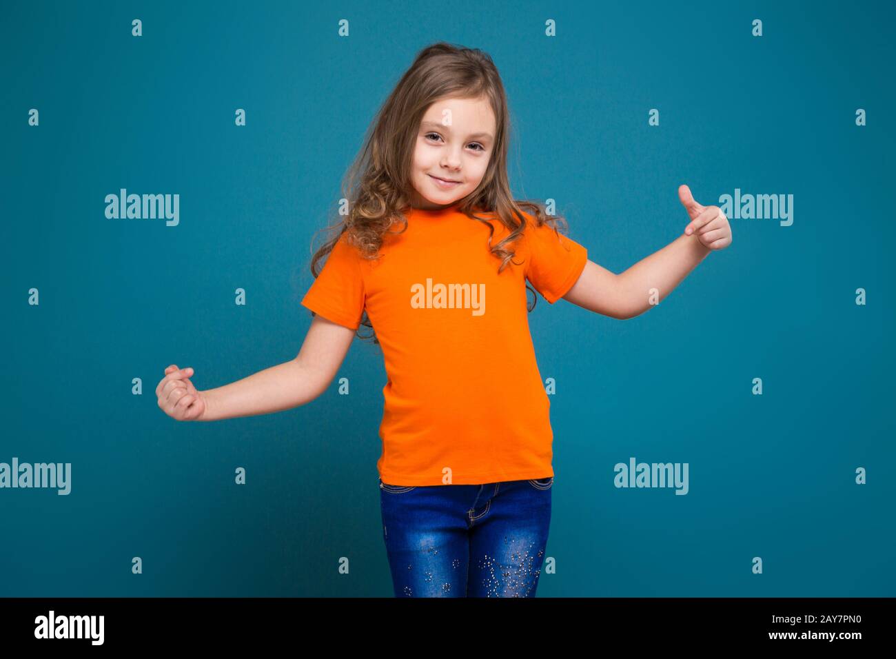 Cute little girl in tee shirt with brown hair Stock Photo
