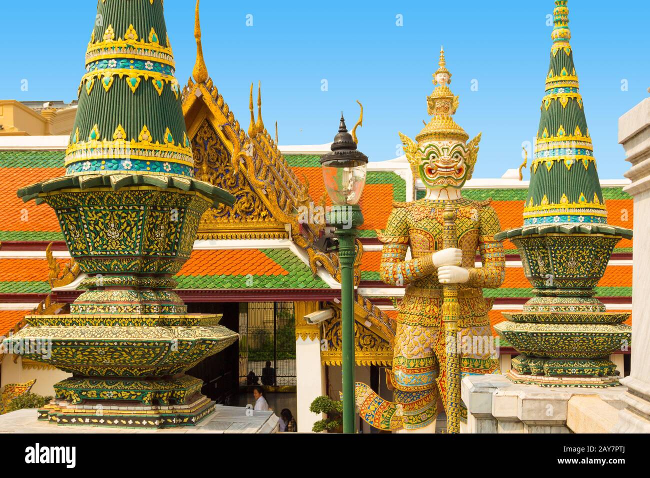 grand palace view gardian statue in wat phra kaew with sun bangkok Stock Photo