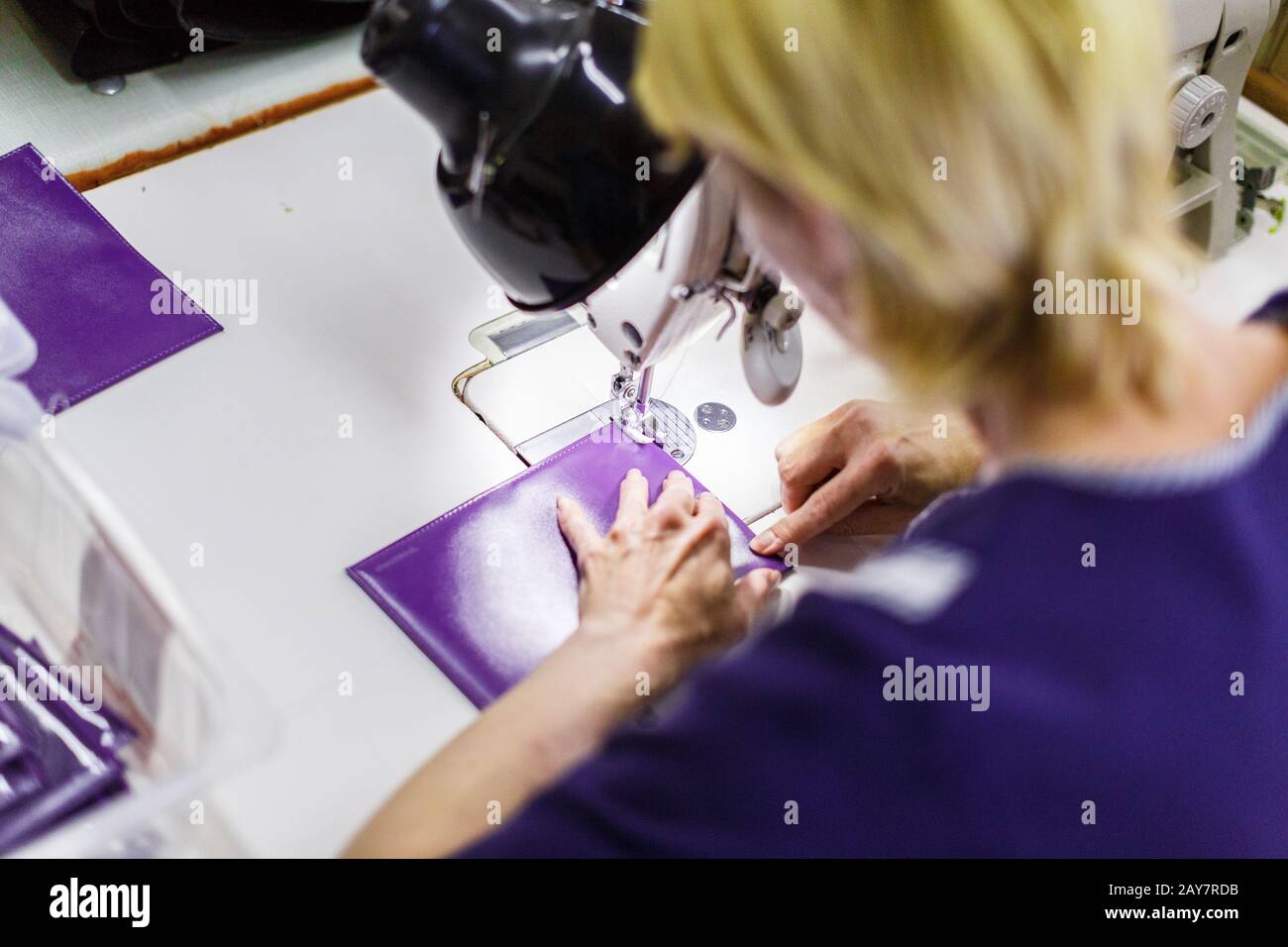woman stitching a purse Stock Photo