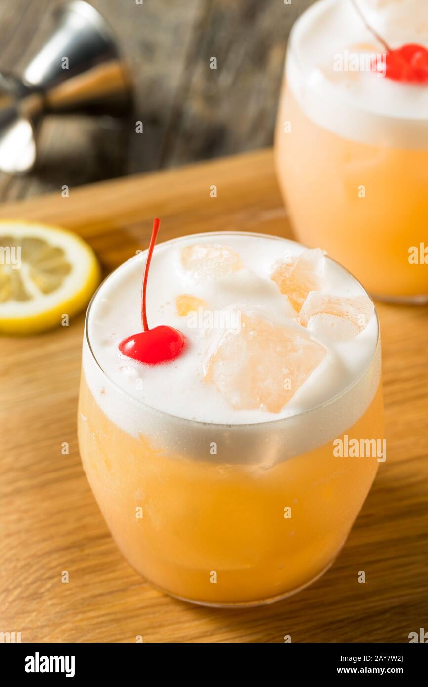 Refreshing Raki Vodka Sour Cocktail with a Cherry Stock Photo