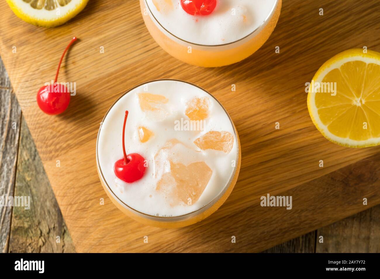 Refreshing Raki Vodka Sour Cocktail with a Cherry Stock Photo