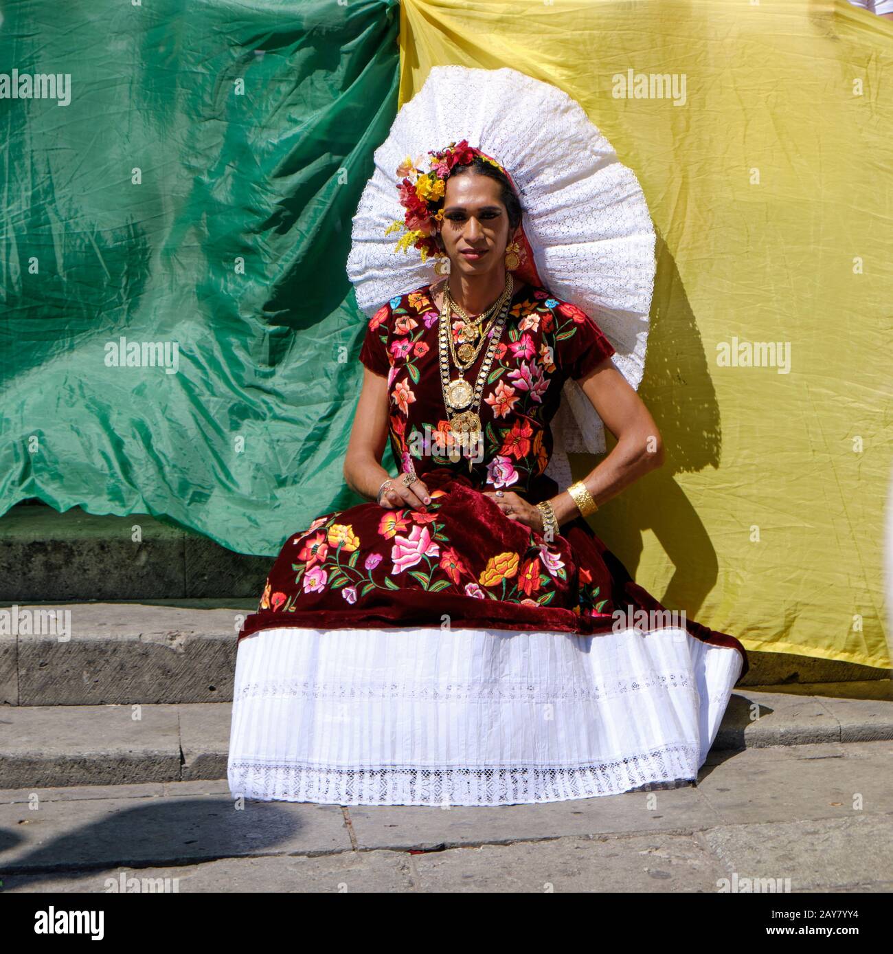 Muxe transgender Estrella Vasquez Guerra posing in front of pride flag in Oaxaca to celebrate LGBTQ inclusion Stock Photo