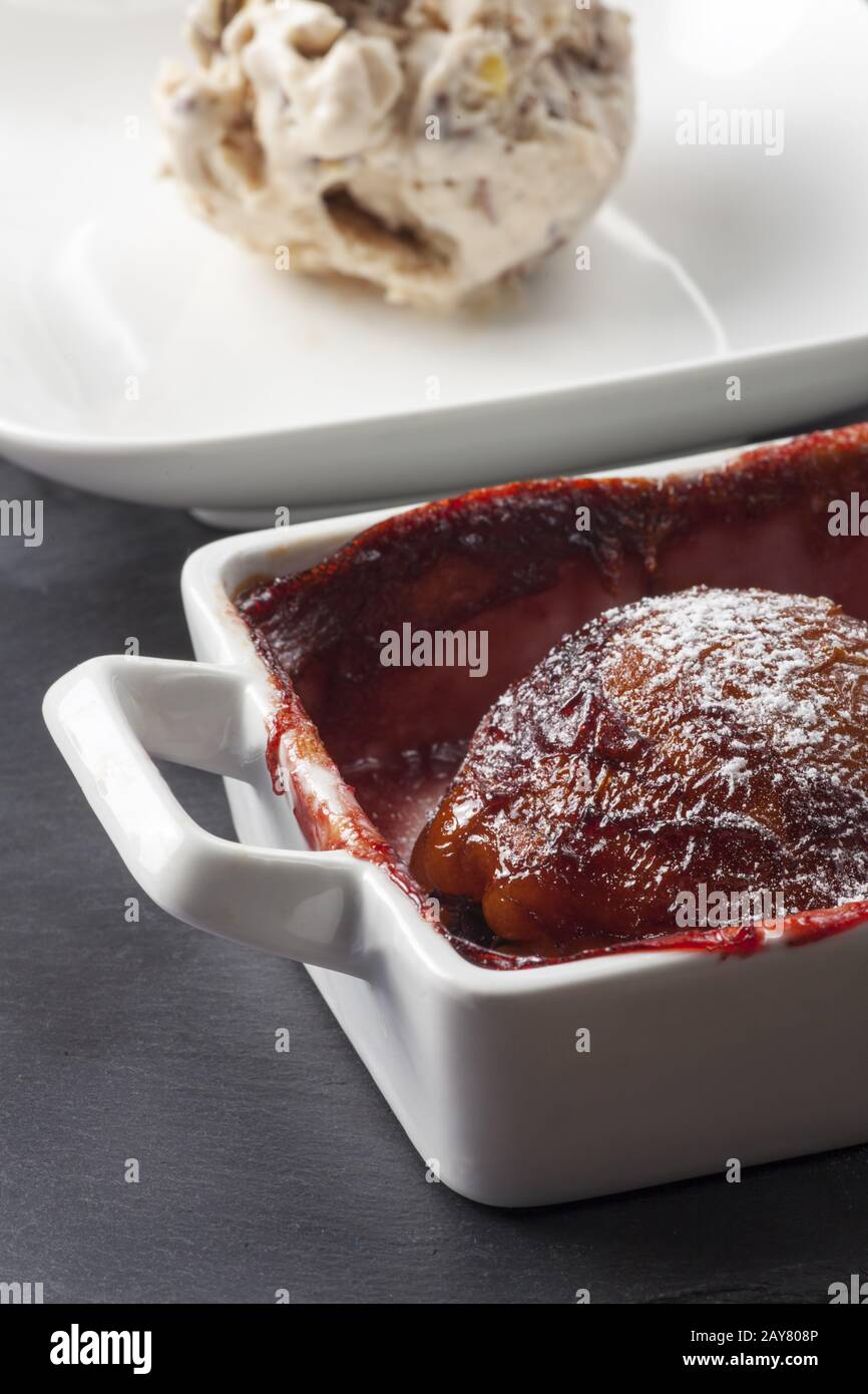 poached pear in red wine with ice Stock Photo