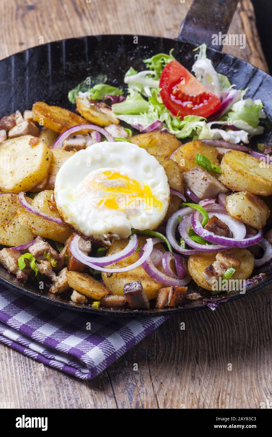 Tyrolean Groestl with fried egg Stock Photo