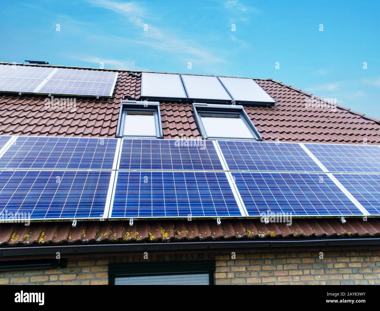 Solar cells on a house roof hi-res stock photography and images - Alamy