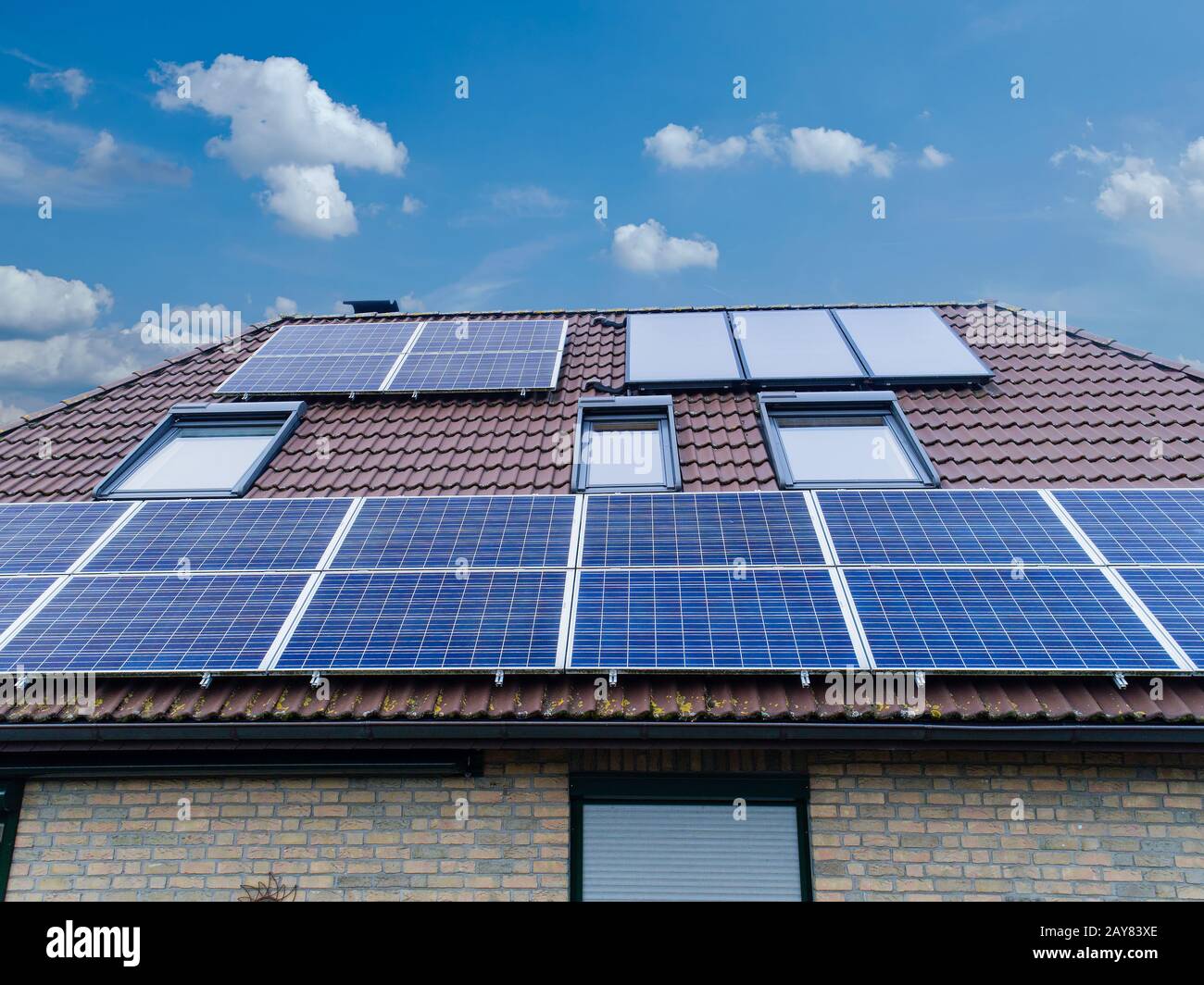 Solar cells on a house roof hi-res stock photography and images - Alamy