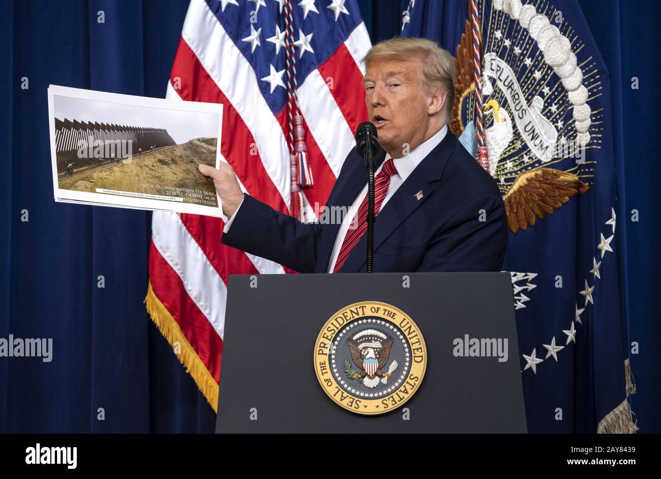 Washington DC, USA. 14th Feb, 2020. President Donald Trump holds up a ...