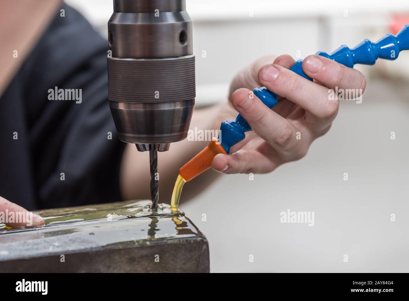 Drill a hole in steel with a metal drill bit using coolant Nautical