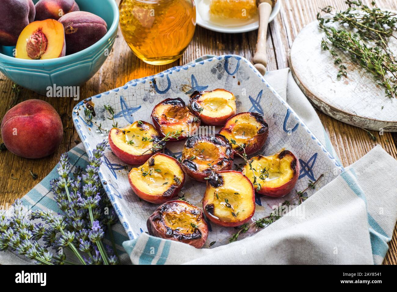 baked peaches with honey and thyme Stock Photo Alamy