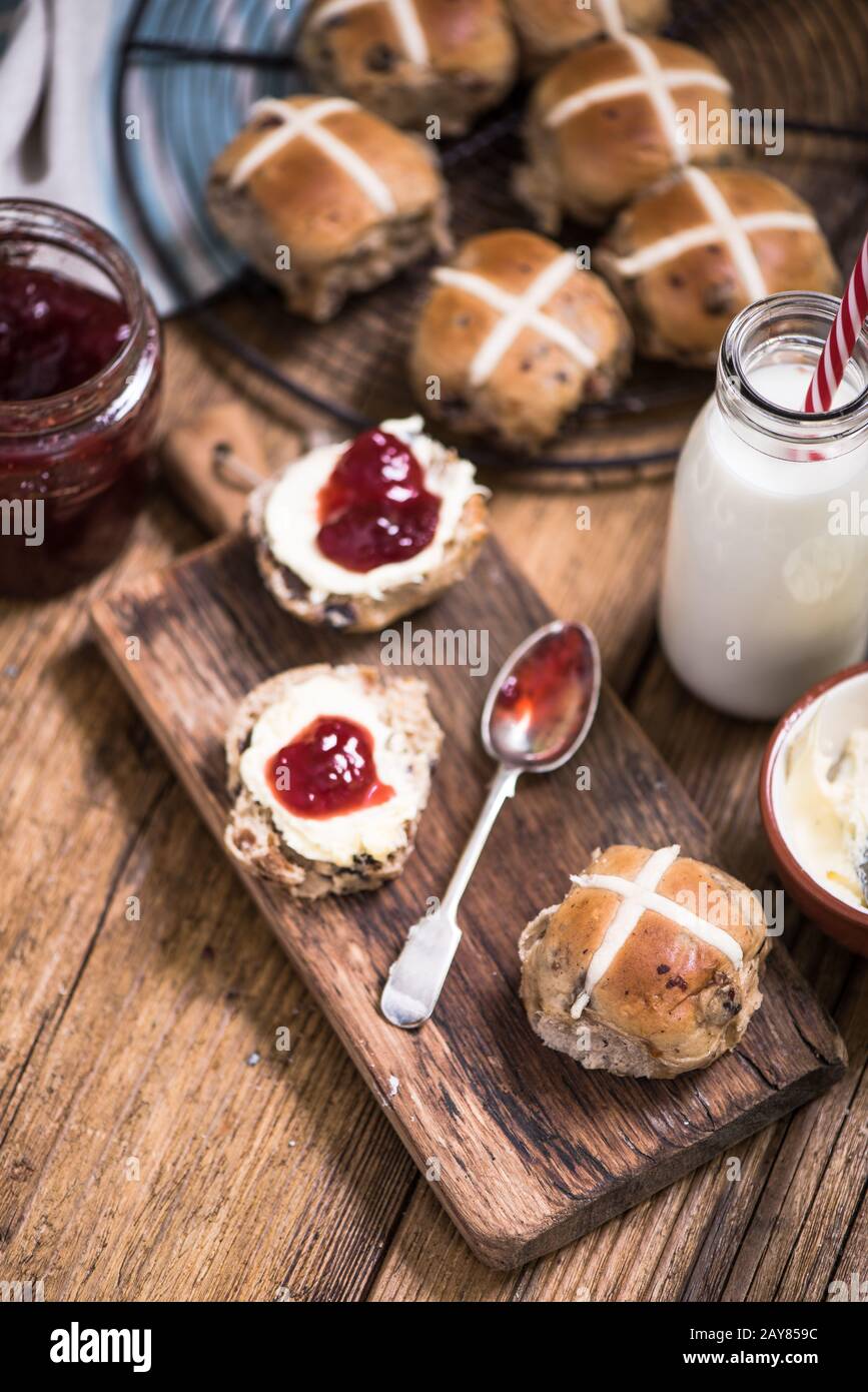 creamy tea, hot cross bun Stock Photo Alamy