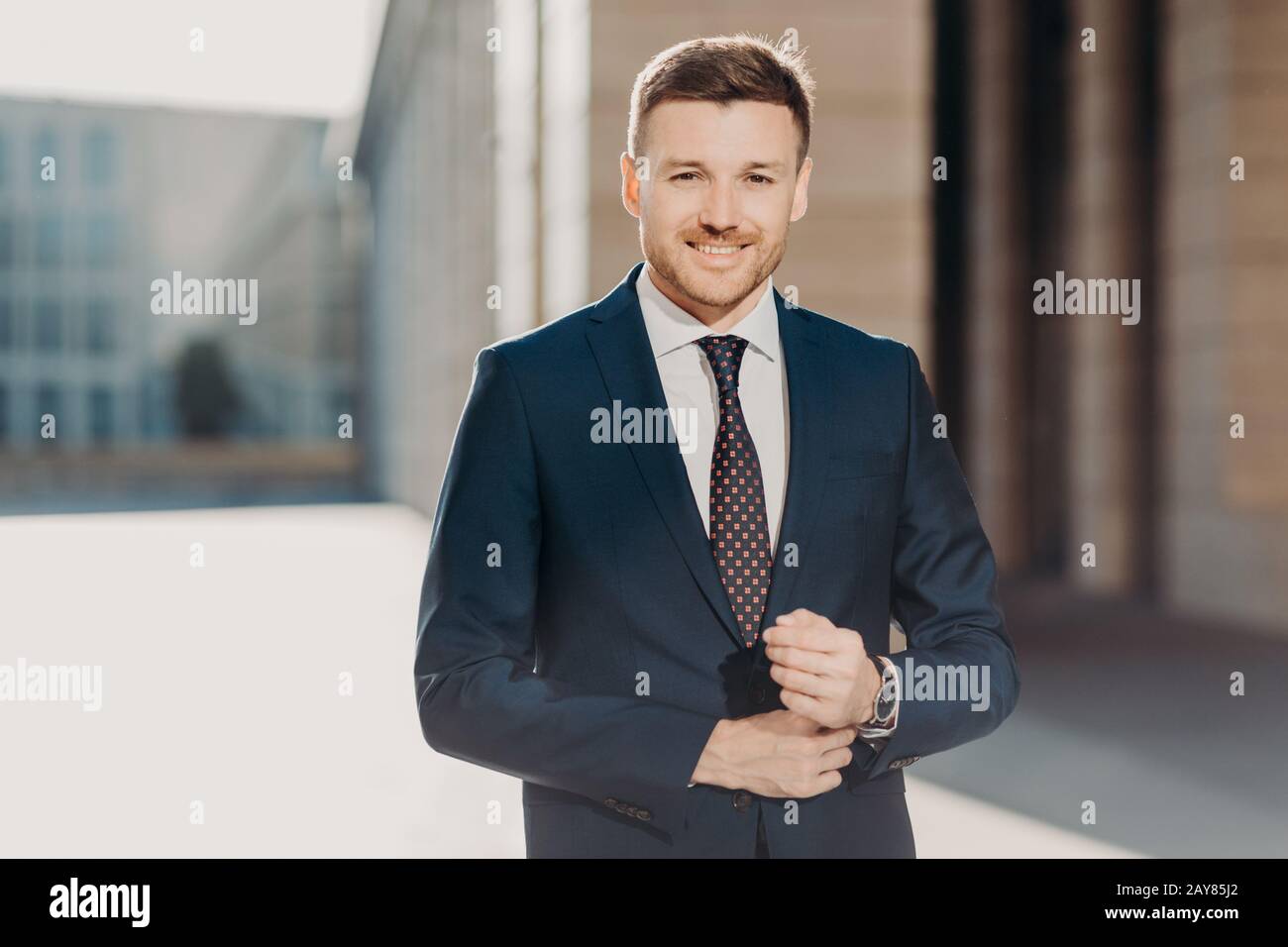 Portrait of a handsome young man in formal fancy suit posing on Stock Photo  by ©ASphoto777 169631302
