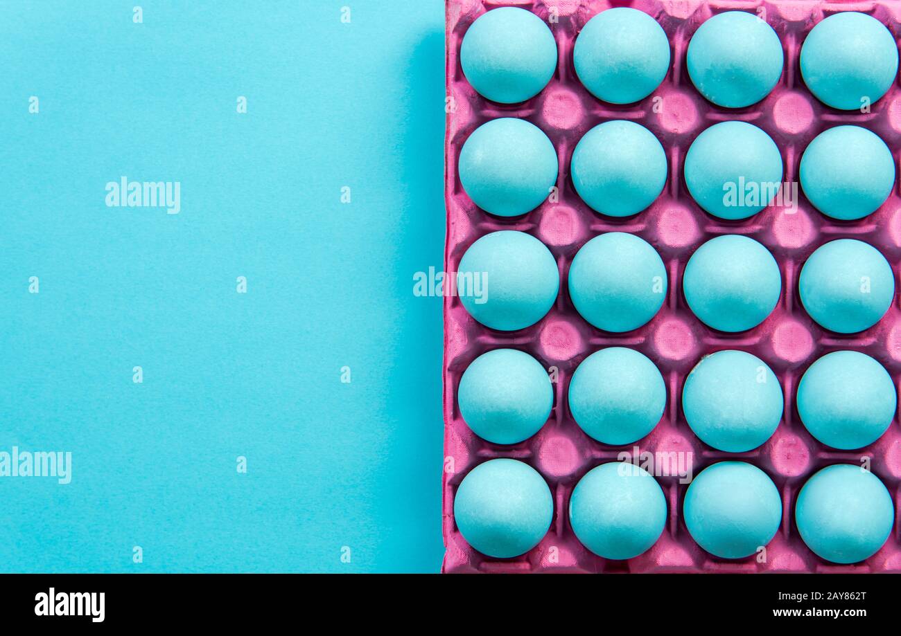 Pastel blue eggs in pinky tray Stock Photo Alamy