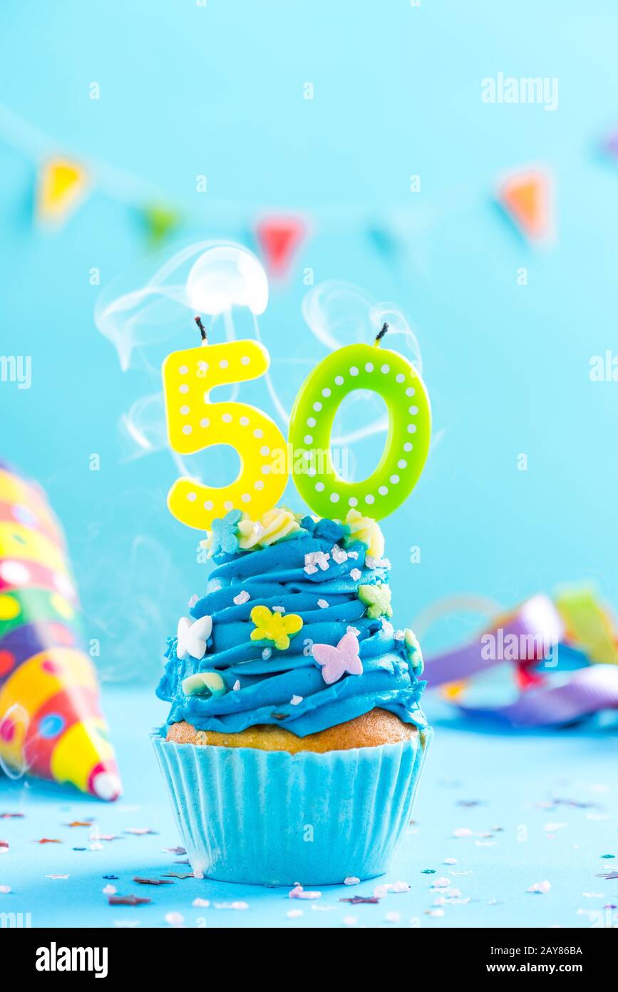 Fiftieth 50th birthday cupcake with candle blow out.Card mockup. Stock Photo
