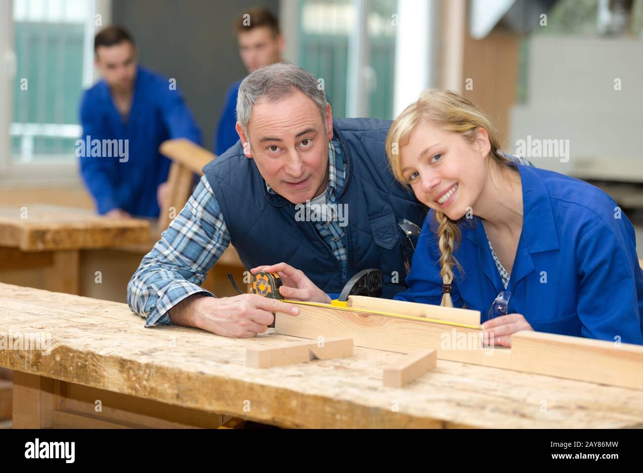 Woman Apprentice And Man In Workshop Stock Photo 343773609 Alamy