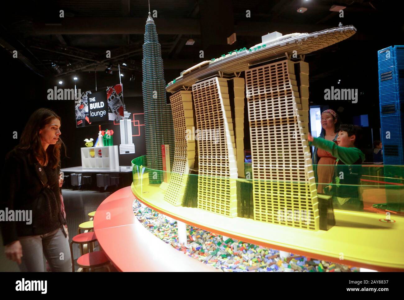 Vancouver Canada. 14th Feb 2020. Visitors look at Singapore s Marina Bay Sands built by LEGO bricks during the exhibition Towers of Tomorrow with LEGO Bricks at Science World in Vancouver Canada Feb