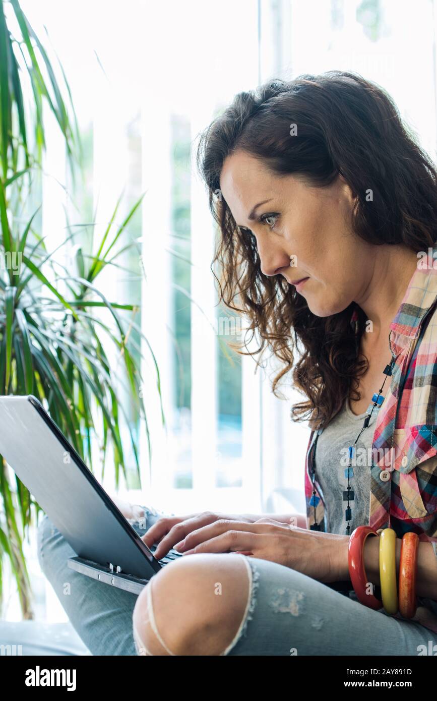 young woman concentrate on laptop work flow Stock Photo