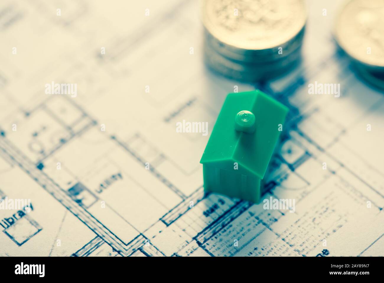 architect house plane and coins, investment concept Stock Photo