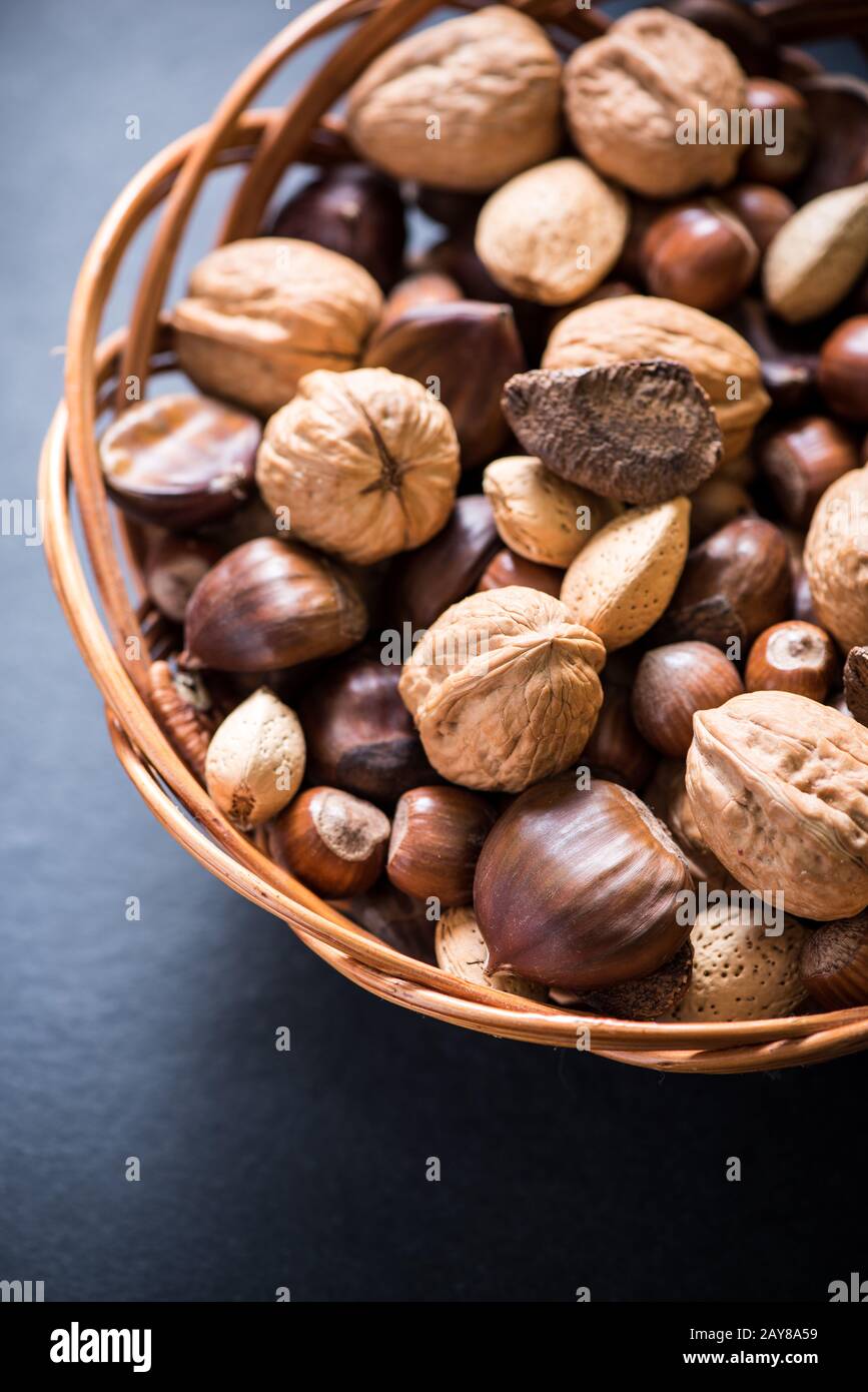 mixed whole nuts in basket Stock Photo