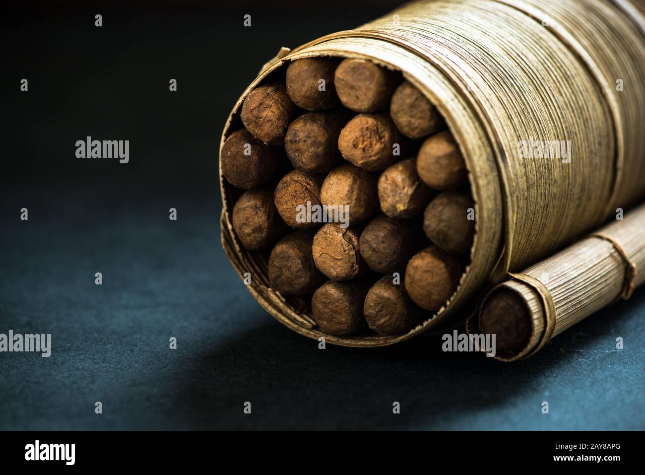 Pile of cigars in pal leafs crafted box Stock Photo
