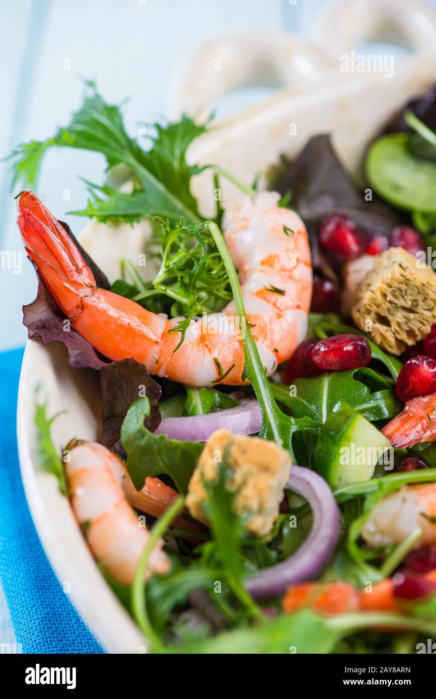 Fresh salad with shrimps and pomegranade seeds Stock Photo