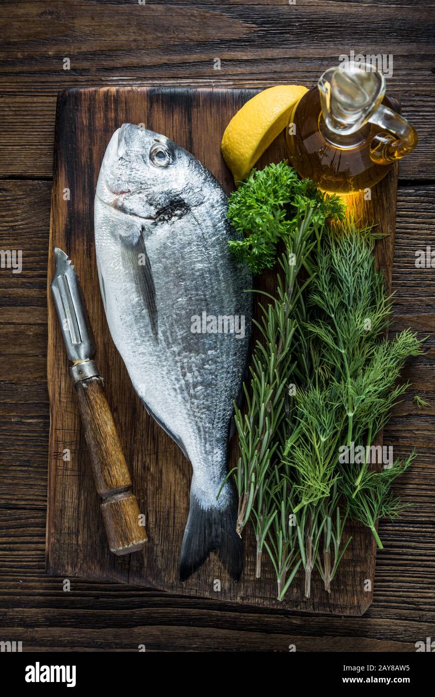 Fresh sea fish and herbs Stock Photo