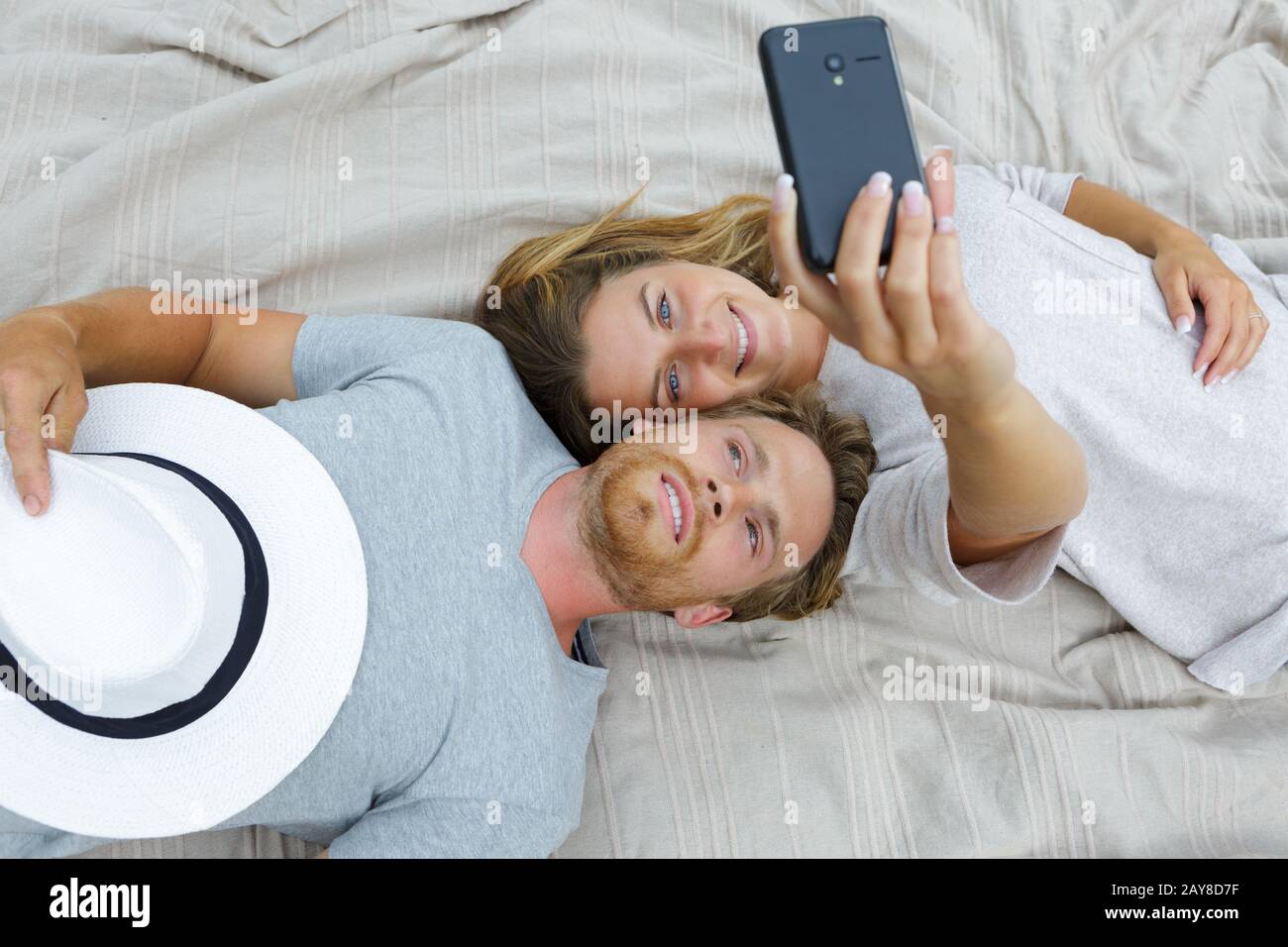 portrait of a happy young couple taking a selfie Stock Photo - Alamy