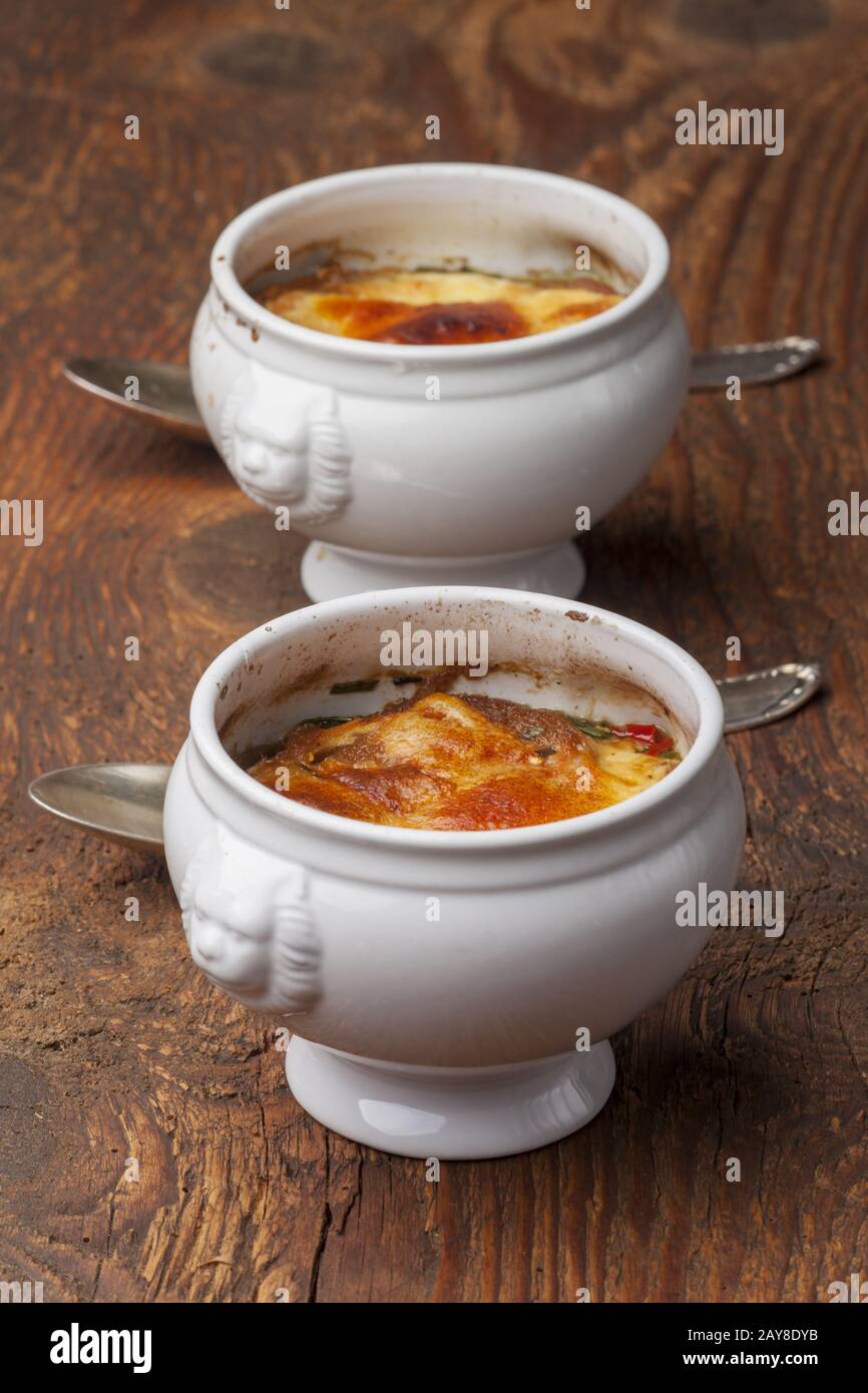 French onion soup with cheese on wood Stock Photo