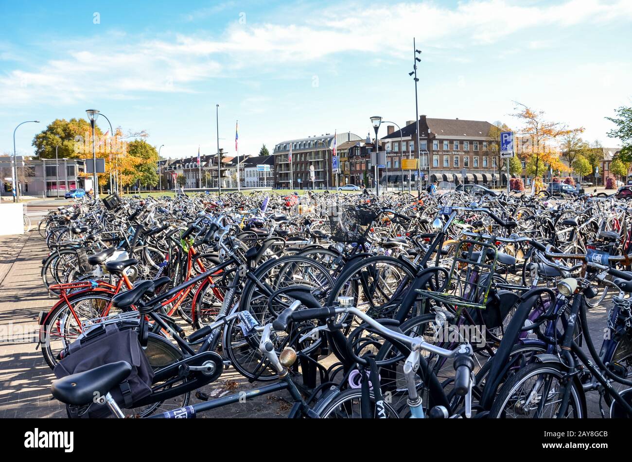 Venlo, Limburg, Netherlands - October 13, 2018: Rows of parked bicycles in the Dutch city close to the main train station. City biking. Eco-friendly means of transport. Stock Photo