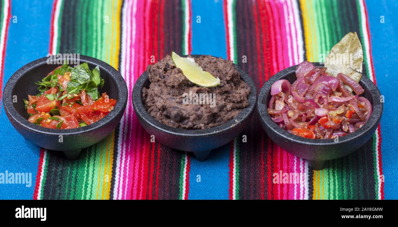 Mexican salsas on a colorful tablecloth Stock Photo