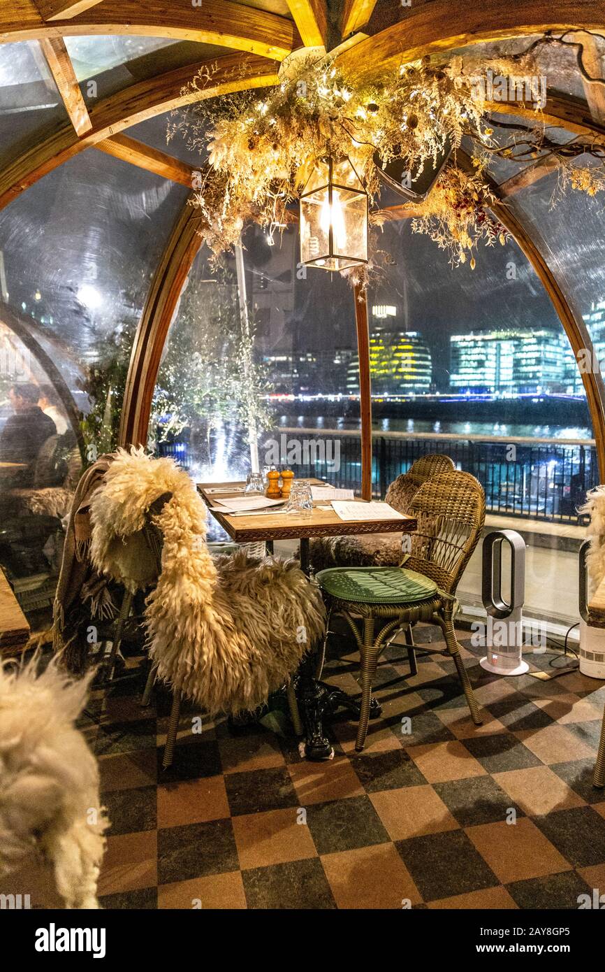 Dining igloos at Coppa Club on the Thames riverbank, London, UK Stock Photo