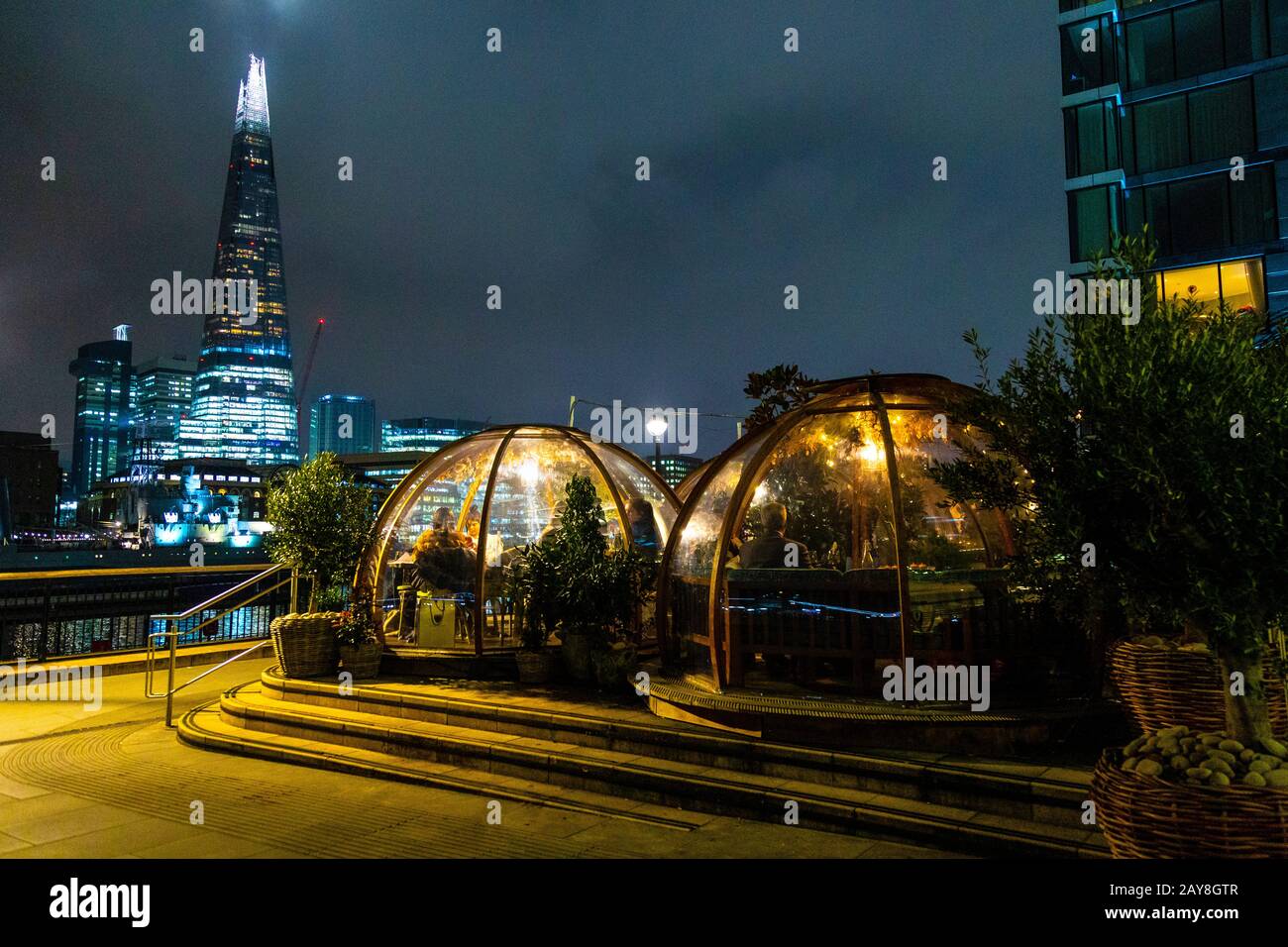 Dining igloos at Coppa Club on the Thames riverbank, London, UK Stock Photo