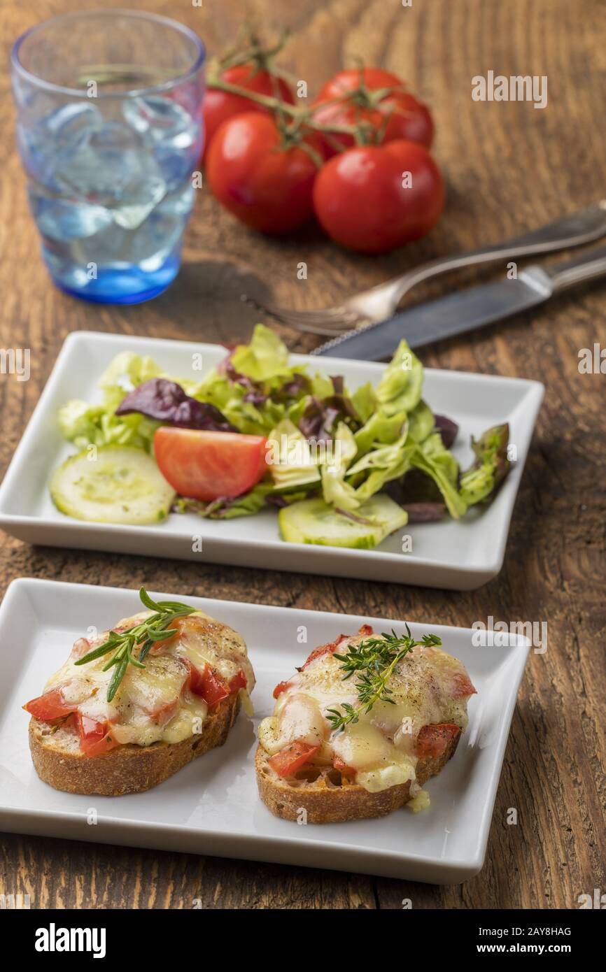 Baguette gratinated with cheese and salad Stock Photo Alamy