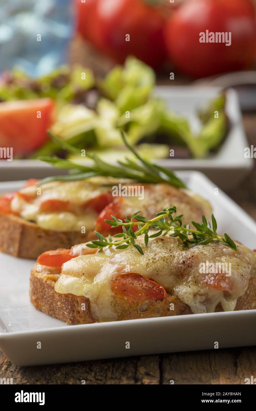Baguette gratinated with cheese and salad Stock Photo Alamy