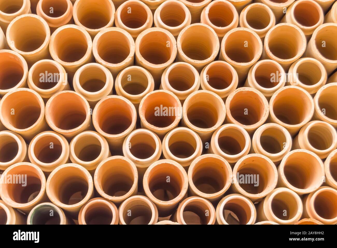 Background of ceramic water downpipes place on each other north Stock Photo