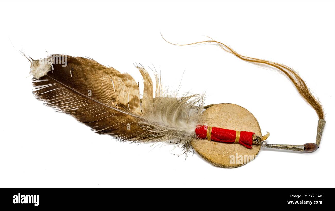 Eagle feather with horse hair as Indian hair accessory isolated on white Stock Photo