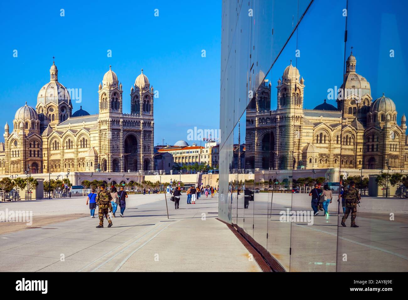 Cathedral of Saint Mary Major is reflected in the mirrored wall Stock Photo