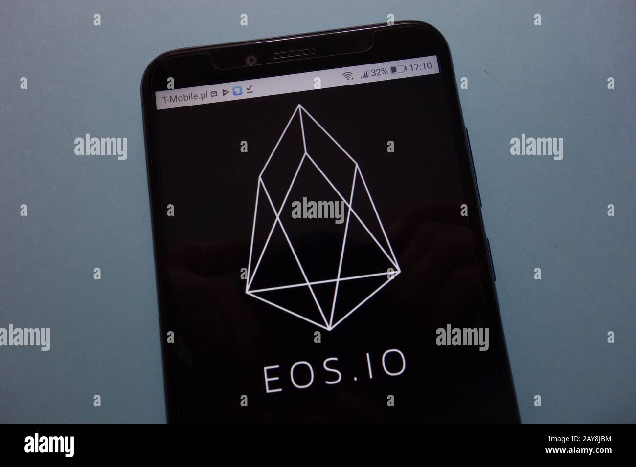 EOS cryptocurrency logo displayed on smartphone Stock Photo