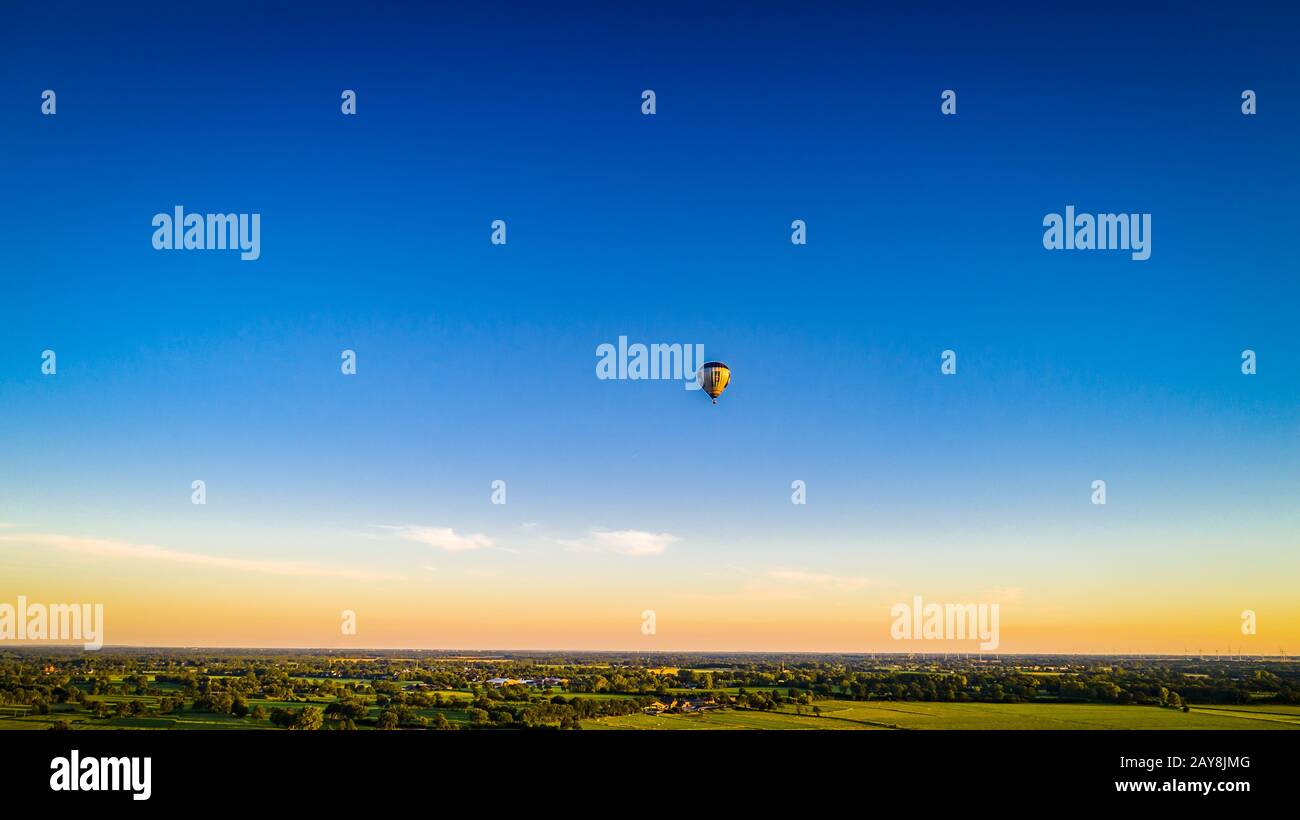 Hot air balloon against blue sky Stock Photo - Alamy