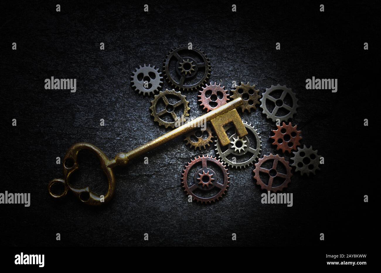 Gears and antique key Stock Photo