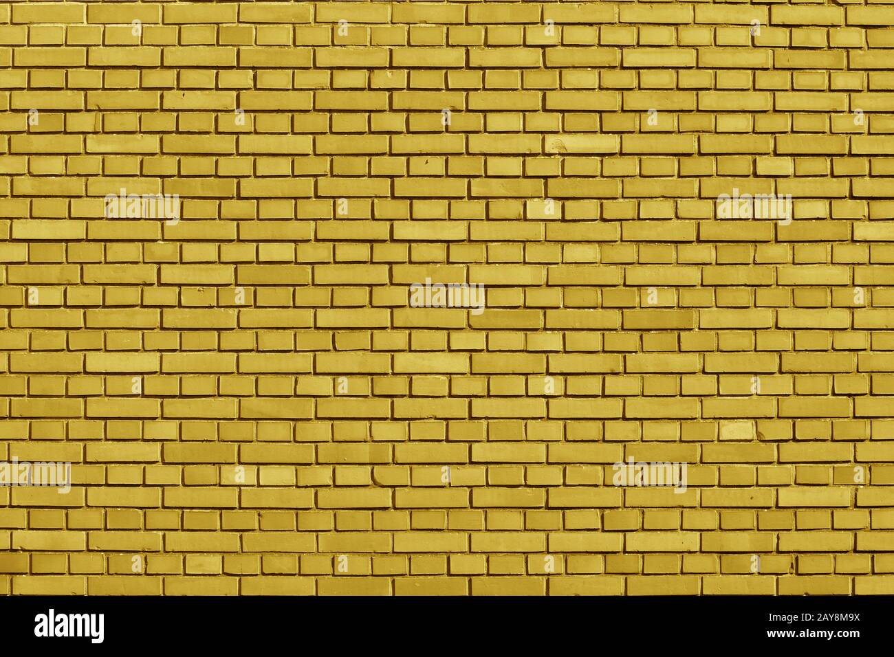 Ceylon Yellow colored brick wall background Stock Photo